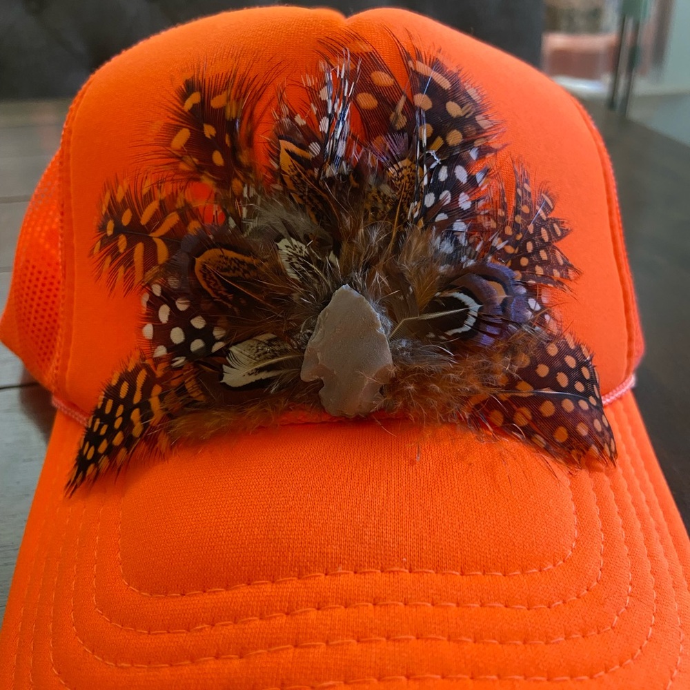 Feather crest trucker hat